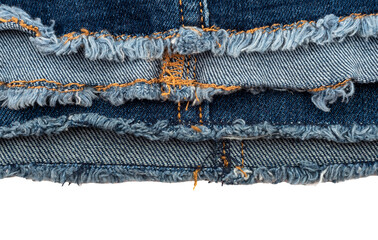 Piece of torn denim on a white background. Denim texture