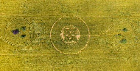 Aerial view of a mysterious, intricate, geometric crop art, crop circle formation in a barley field near Sutton Veny, Wiltshire, England, UK 