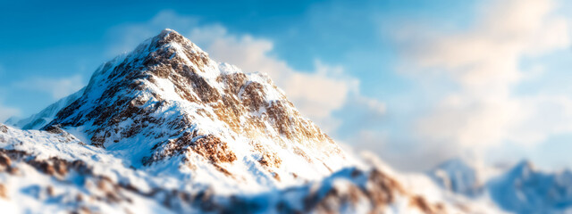 Majestic Snow- Capped Mountain Peak Bathed in Golden Sunlight Un