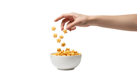 Hand Pouring Star Shaped Cereal into Bowl Against Black Backdrop