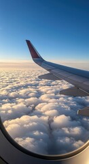 Obraz premium A tranquil view of fluffy clouds from an airplane window, showcasing a serene sky.