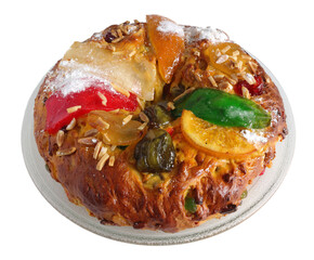 Portugal. Typical Portuguese Christmas cake known as Bolo Rei - King's Cake. Eaten during the Christmas holidays, but traditionally on the 12th day of Christmas. On glass base isolated on white.