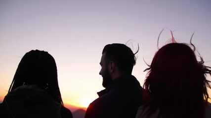 Group Enjoys Sunset View With Calm Atmosphere at Scenic Overlook in Nature During Evening Hours