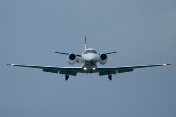 Airplane in the cloudy sky. Private plane in flight, Business jet in the sky.