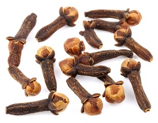 Dried cloves scattered on white background