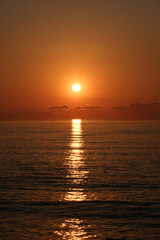 Beautiful sunset over the sea. The sun sets over the sea. Sunset on the Black Sea.