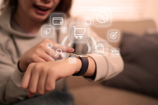 Asian adult woman uses smartwatch for online shopping connecting digital commerce deals home environment