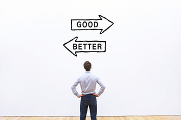 good vs better comparison concept, optimization and improvement, business man looking at arrows on white wall