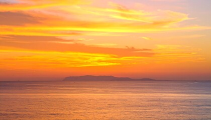 Obraz premium Vibrant sunset over calm ocean waters