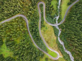 Winding Mountain Road Through Lush Forest – Aerial View