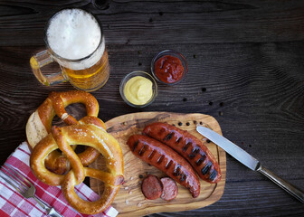 Bavarian sausages with pretzels and beer