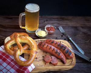 Bavarian sausages with pretzels and beer