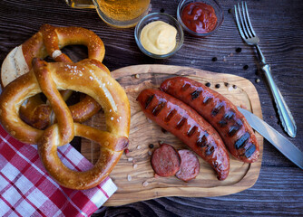 Bavarian sausages with pretzels and beer