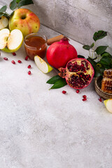 Rosh Hashana concept with honey, apple and pomegranate