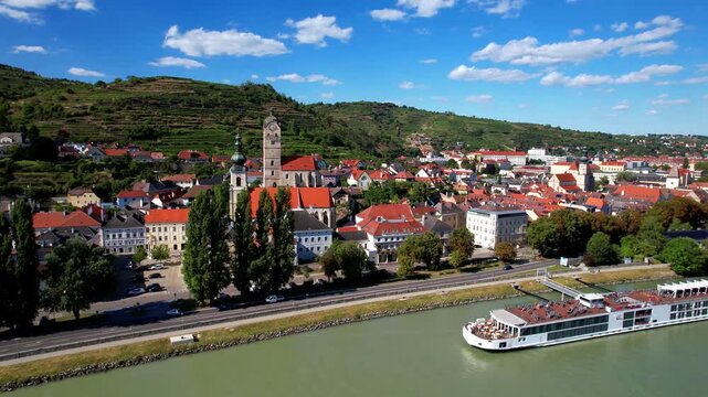 Austria Krems an der Donau Aerial 4K Video Danube River Cruise Ship in Front of Historic Town Architecture. Scenic Wachau Valley Wine Region, Landmarks Traditional Austrian Village Travel View
