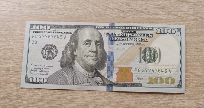 American one hundred dollar paper banknote. Hundred USD cash macro view. 100 Dollar Cash. Hundred Dollar Closeup. 100 USD Bills. Concept Finance Business Investment Success.