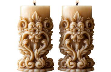 a pair of carved candles with ornate designs, isolated on a transparent background.
