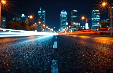 City street at night with light trails from moving vehicles and illuminated skyscrapers in the background