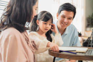 Dad, Mom, and daughter enjoy a moment of joyful homework on the sofa, a peaceful scene of family togetherness at home. They embrace a cheerful lifestyle, making study an exciting part of life