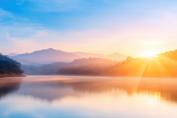 Fototapeta premium Sunrise Symphony: A serene morning scene unfolds as the sun majestically rises, painting the sky with vibrant hues and casting a golden glow upon a tranquil lake.