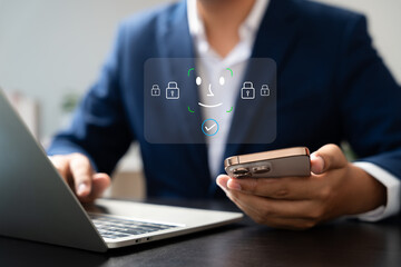 Businessman using smartphone with face recognition and password authentication for secure login, illustrating modern cybersecurity, privacy protection, data protection, digital identity concept.