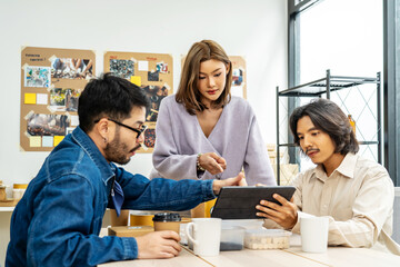 Fototapeta premium Creative Team Meeting , discussion reusable product, implementing environmental protection for clean and sustainable future ecology, ESG social governance ideas, exchanging ideas and planning