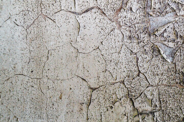 Textured Wall's Imperfection: The weathered surface of an old wall unveils a tapestry of cracks, peeling paint, and imperfections, offering a glimpse into the passage of time and the elements.