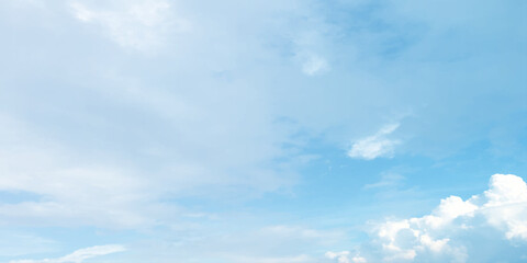 Blue clouds, sunny sunlight effect on the white fluffy clouds, rainy day, fresh natural weather background banner marketing image, surface splashed 