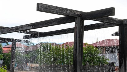 Heavy Rain Curtain Falling on Wooden Pergola Structure