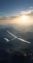 Gliding plane high above mountains at sunset