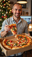 Man holding slice of festive Christmas pizza with red and green toppings in decorated office