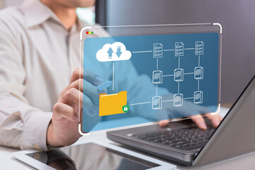 A person interacts with a digital interface displaying cloud computing and data management concepts on a laptop.