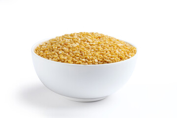 moong dal, specifically the split and husked yellow variety 
 Moong dal is a type of lentil, scientifically known as Vigna radiata. The variety shown is yellow moong dal, which is skinned