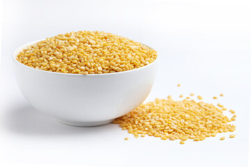 moong dal, specifically the split and husked yellow variety 
 Moong dal is a type of lentil, scientifically known as Vigna radiata. The variety shown is yellow moong dal, which is skinned