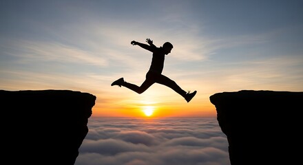 Silhouette of a man jumping across a gap between two cliffs at sunset, symbolizing courage, achievement, and overcoming challenges