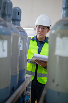 Inspection gas sf6 substation insulation worker safety helmet clipboard industrial storage cylinders technician checking equipment in factory environment