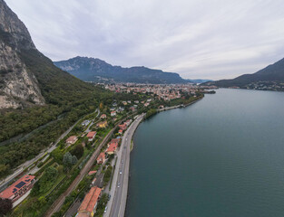 Fototapeta premium Aerial city landscape of Lecco village in Lake Como Italian Alps overcast fall day in Lombardy