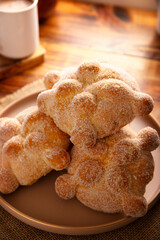 Pan de Muerto. Traditional Mexican sweet bread that is consumed in the season of the day of the dead. It is a main element in the altars and offerings in the festivity of Dia de Muertos in Mexico.