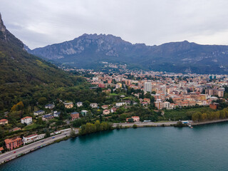 Fototapeta premium Aerial city landscape of Lecco village in Lake Como Italian Alps overcast fall day in Lombardy