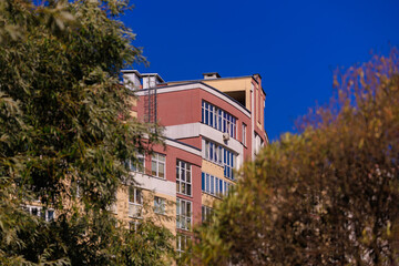 Cityscape on a sunny day, modern buildings and houses 