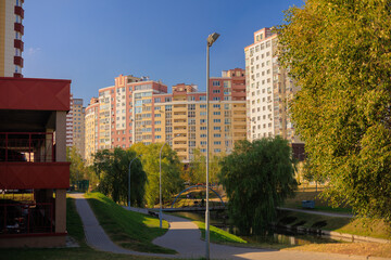 Cityscape on a sunny day, modern buildings and houses 