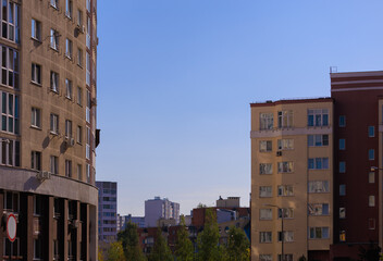Cityscape on a sunny day, modern buildings and houses 