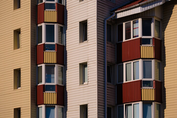 Cityscape on a sunny day, modern buildings and houses 