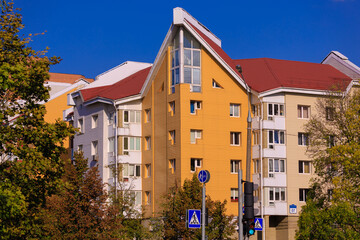 Cityscape on a sunny day, modern buildings and houses 