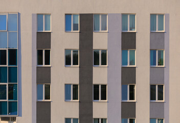 Cityscape on a sunny day, modern buildings and houses 