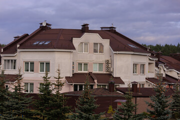 Cityscape on a summer day, modern buildings and houses 