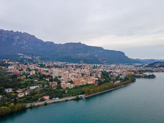 Obraz premium Aerial city landscape of Lecco village in Lake Como Italian Alps overcast fall day in Lombardy