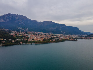 Fototapeta premium Aerial city landscape of Lecco village in Lake Como Italian Alps overcast fall day in Lombardy