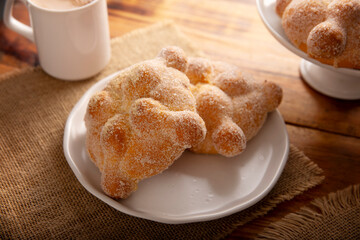 Pan de Muerto. Traditional Mexican sweet bread that is consumed in the season of the day of the dead. It is a main element in the altars and offerings in the festivity of Dia de Muertos in Mexico.