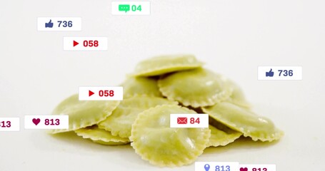 Displaying pile of green ravioli sitting on studio counter, with social media icon overlays